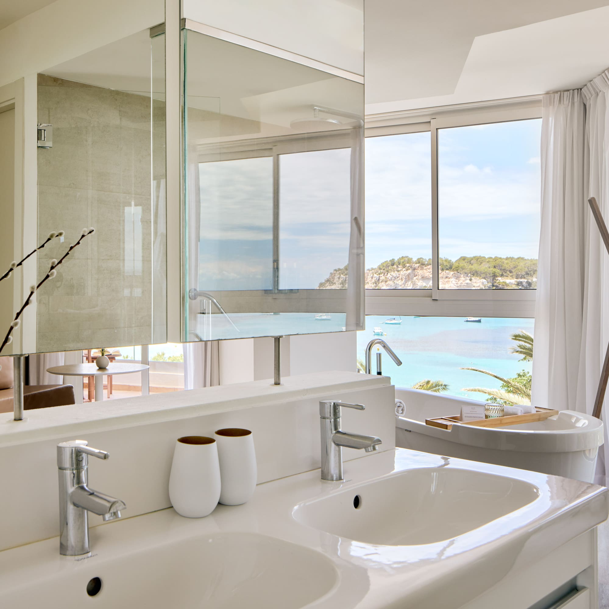 a bathroom with a large window and a sink