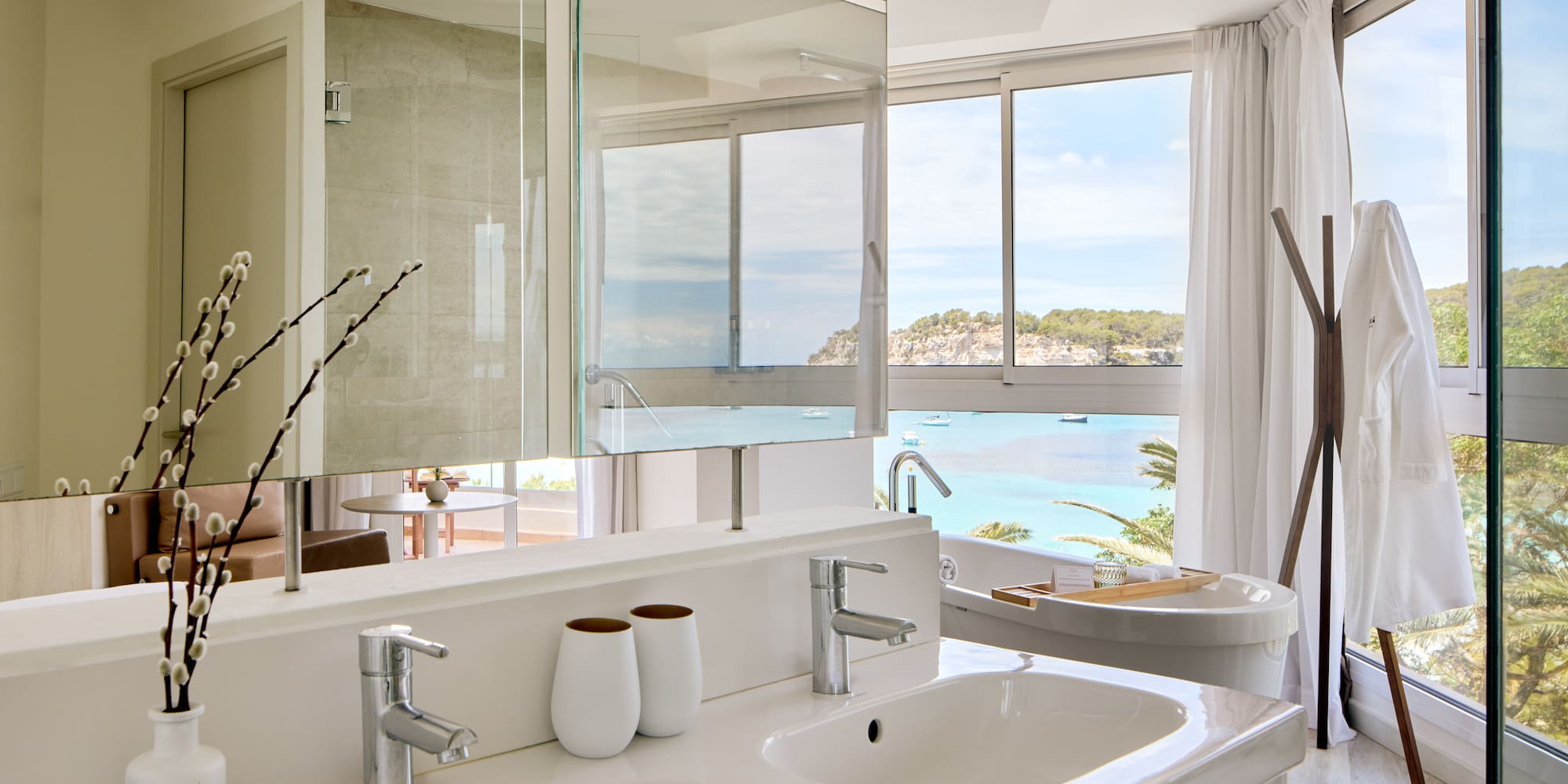a bathroom with a large window and a sink