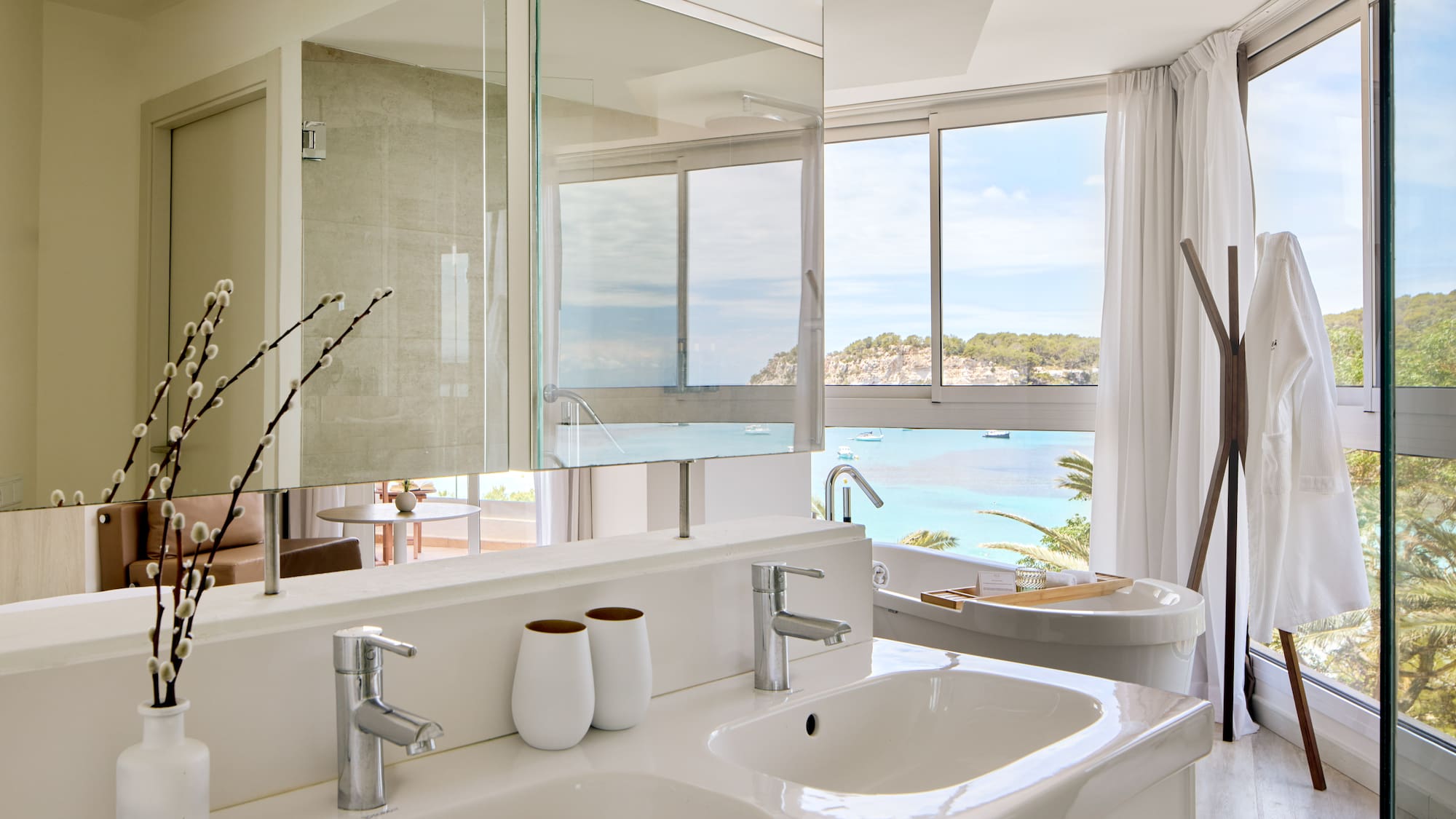 a bathroom with a large window and a sink