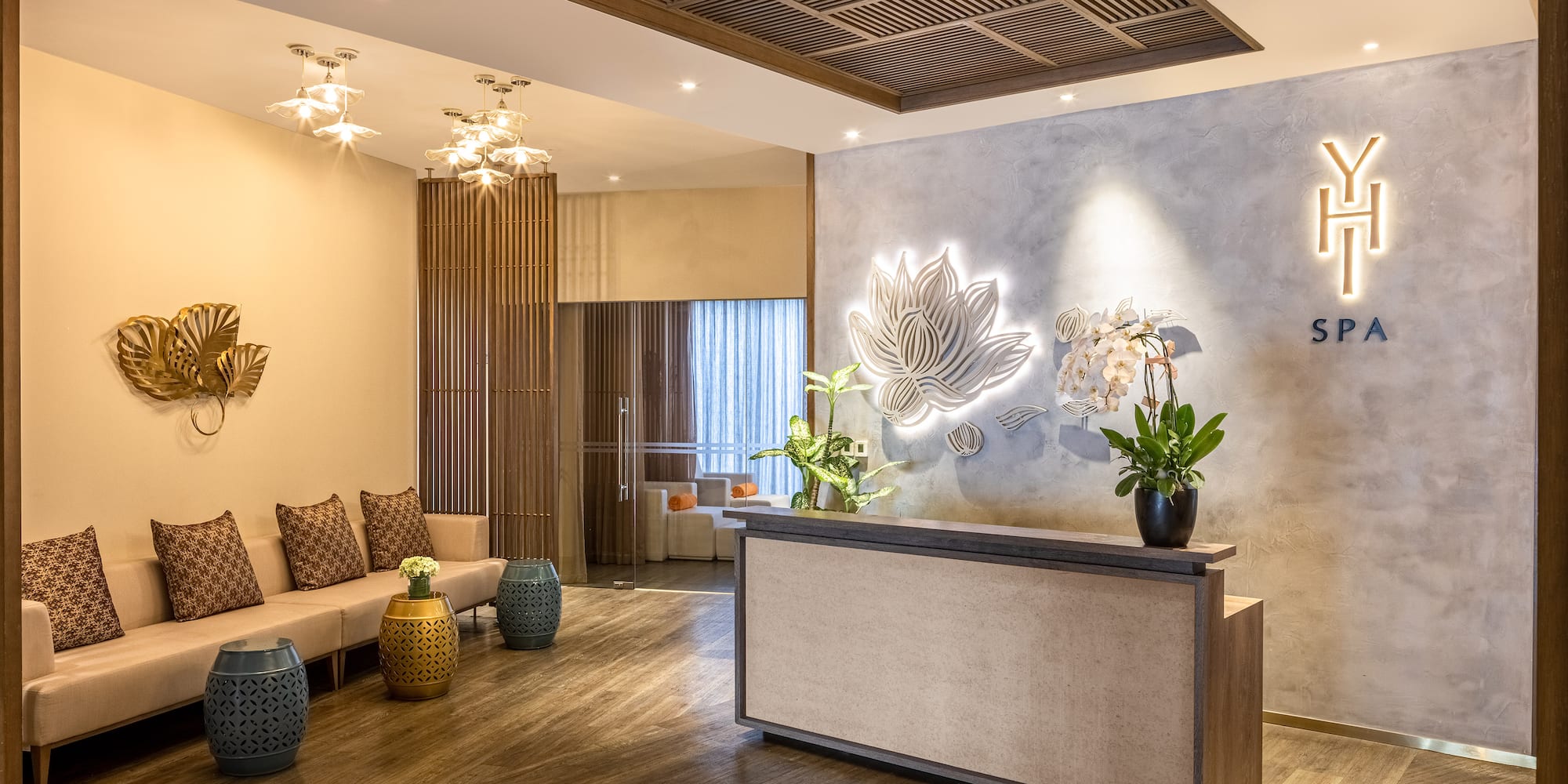 a lobby with a reception desk and a couch