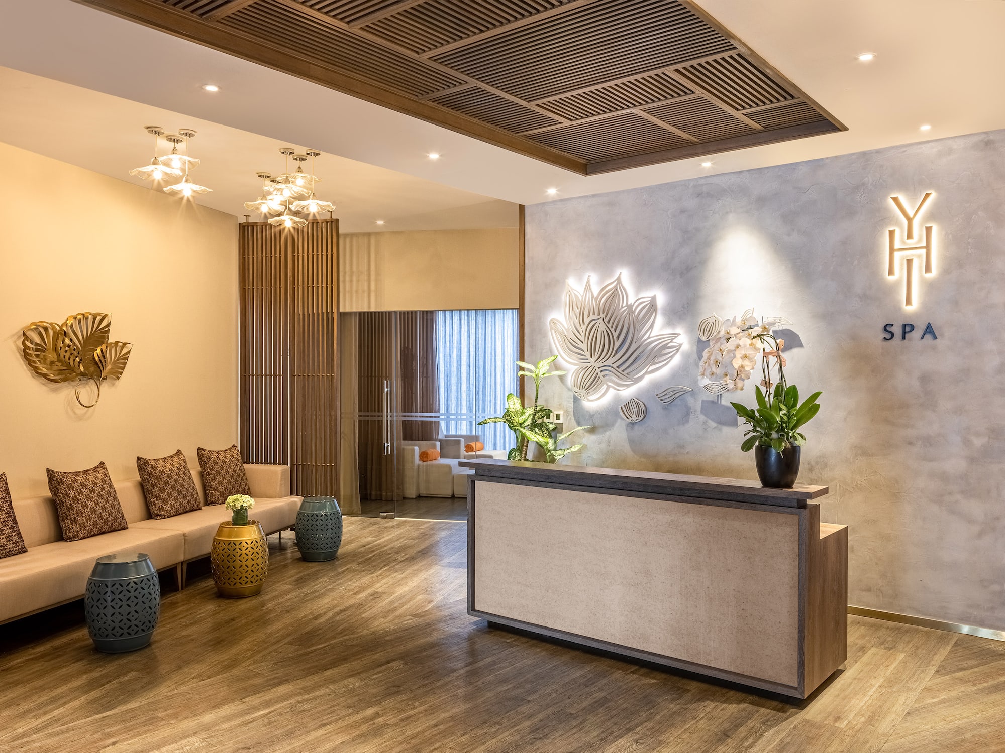 a lobby with a reception desk and a couch