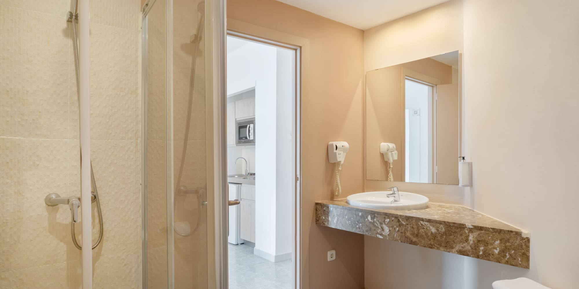 a bathroom with a sink and shower