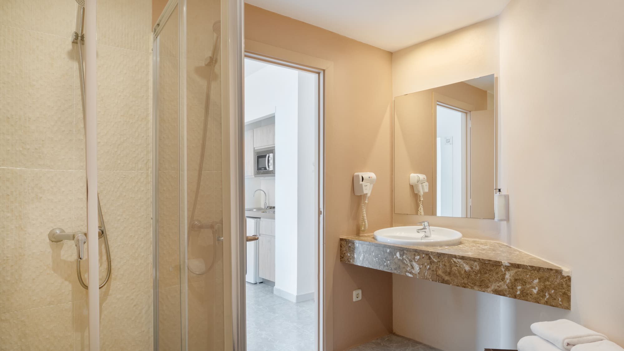a bathroom with a sink and shower