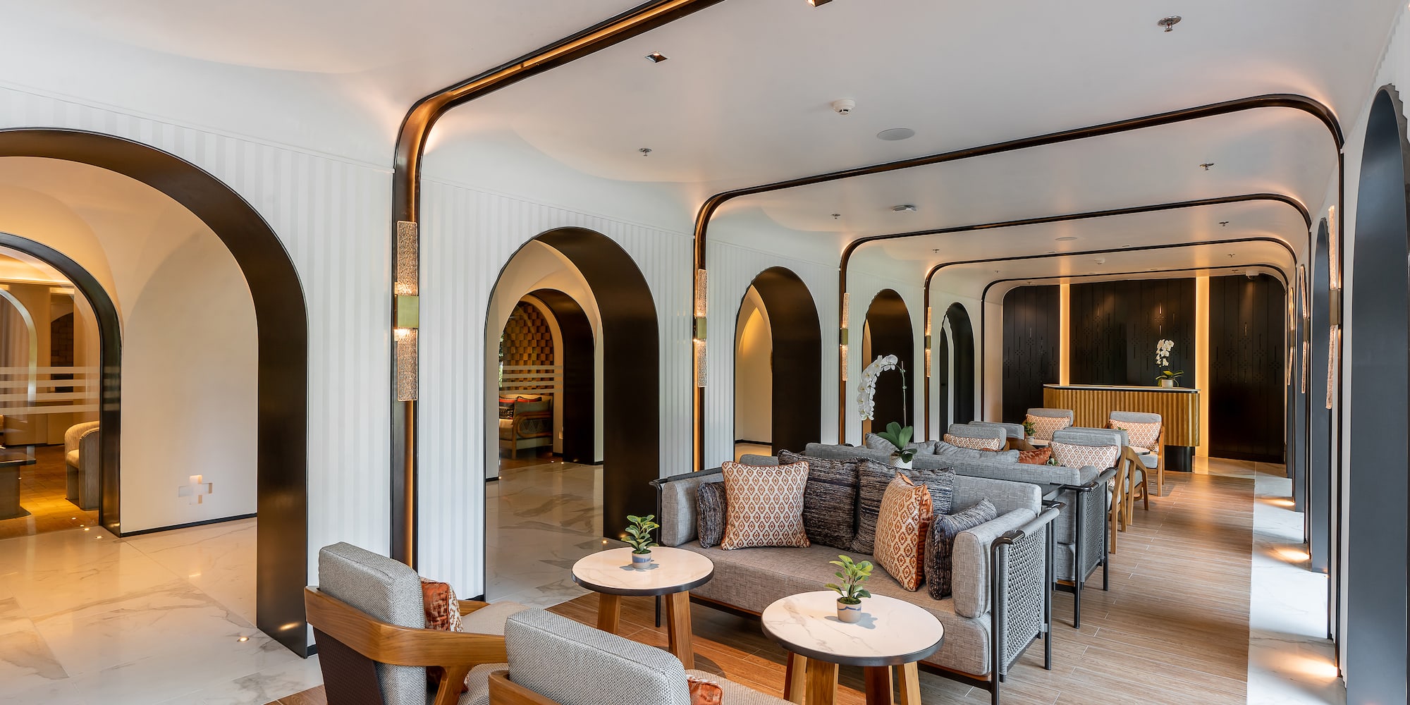 a room with a couch and tables