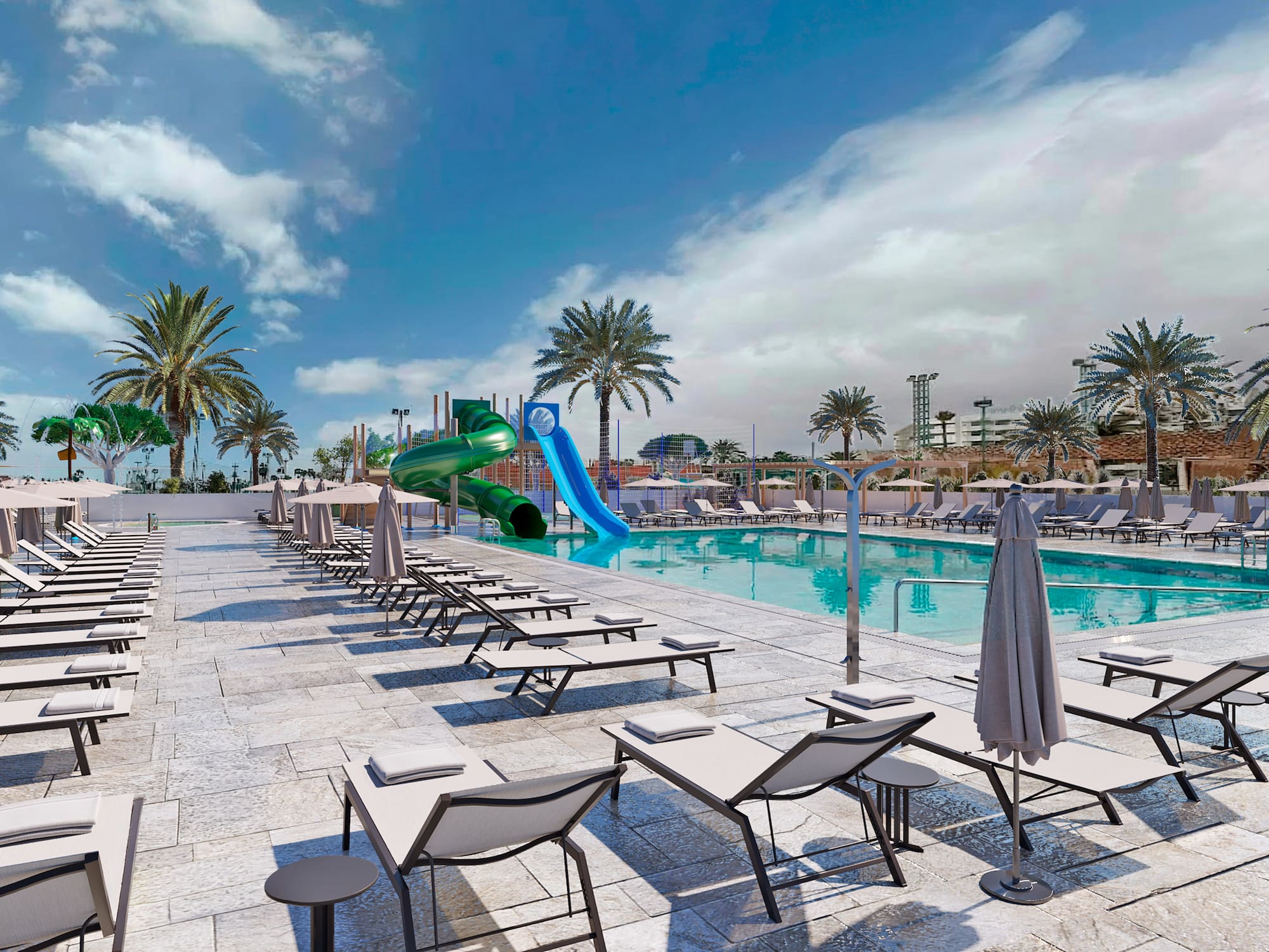 a pool with lounge chairs and a slide