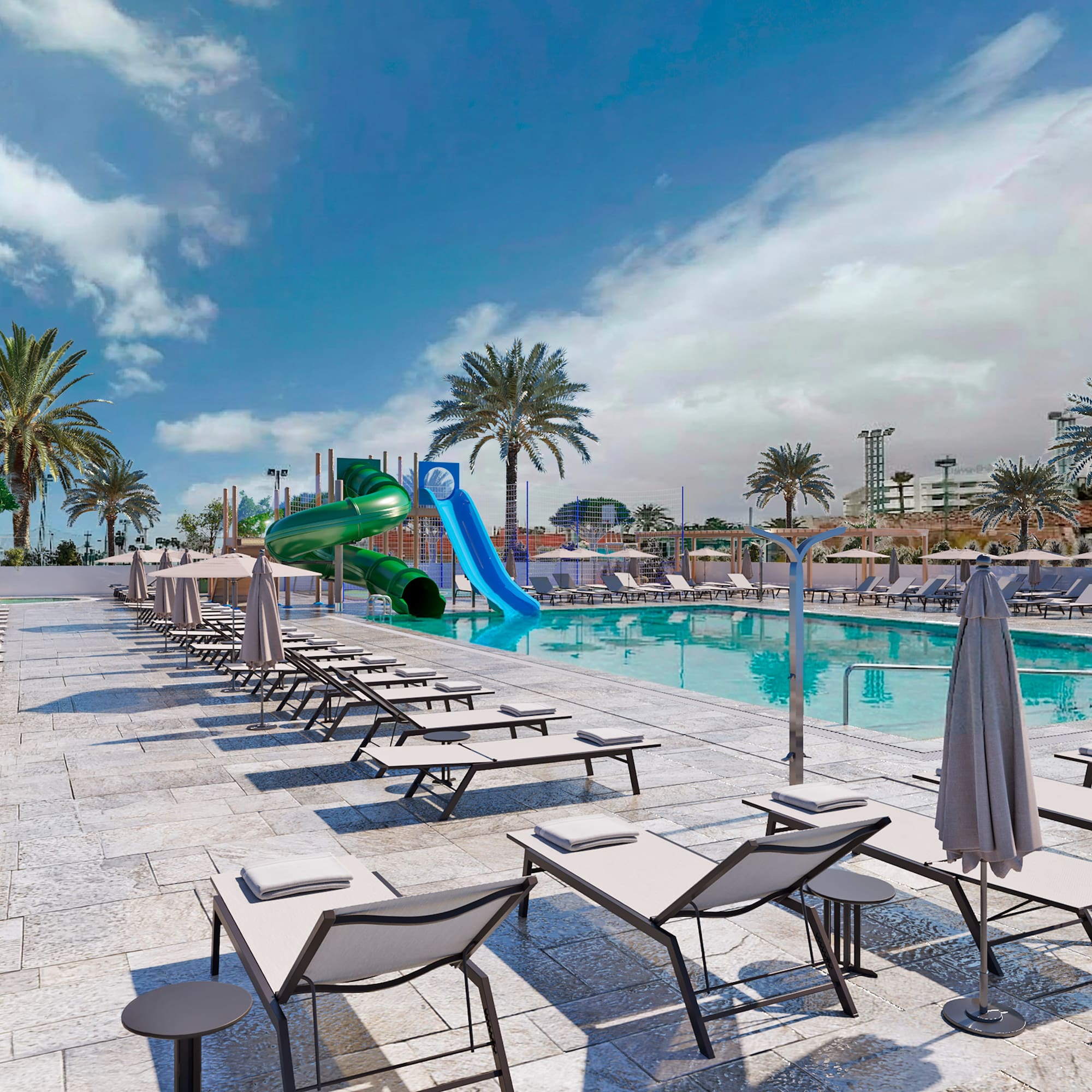 a pool with lounge chairs and a slide