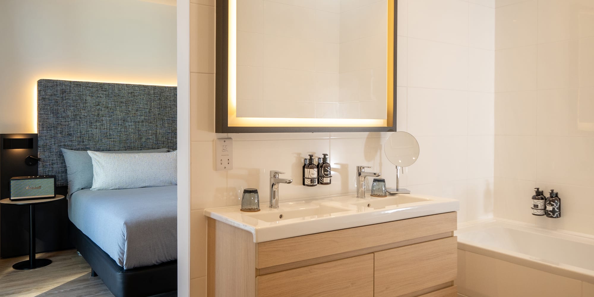 a bathroom with a mirror and a bathtub