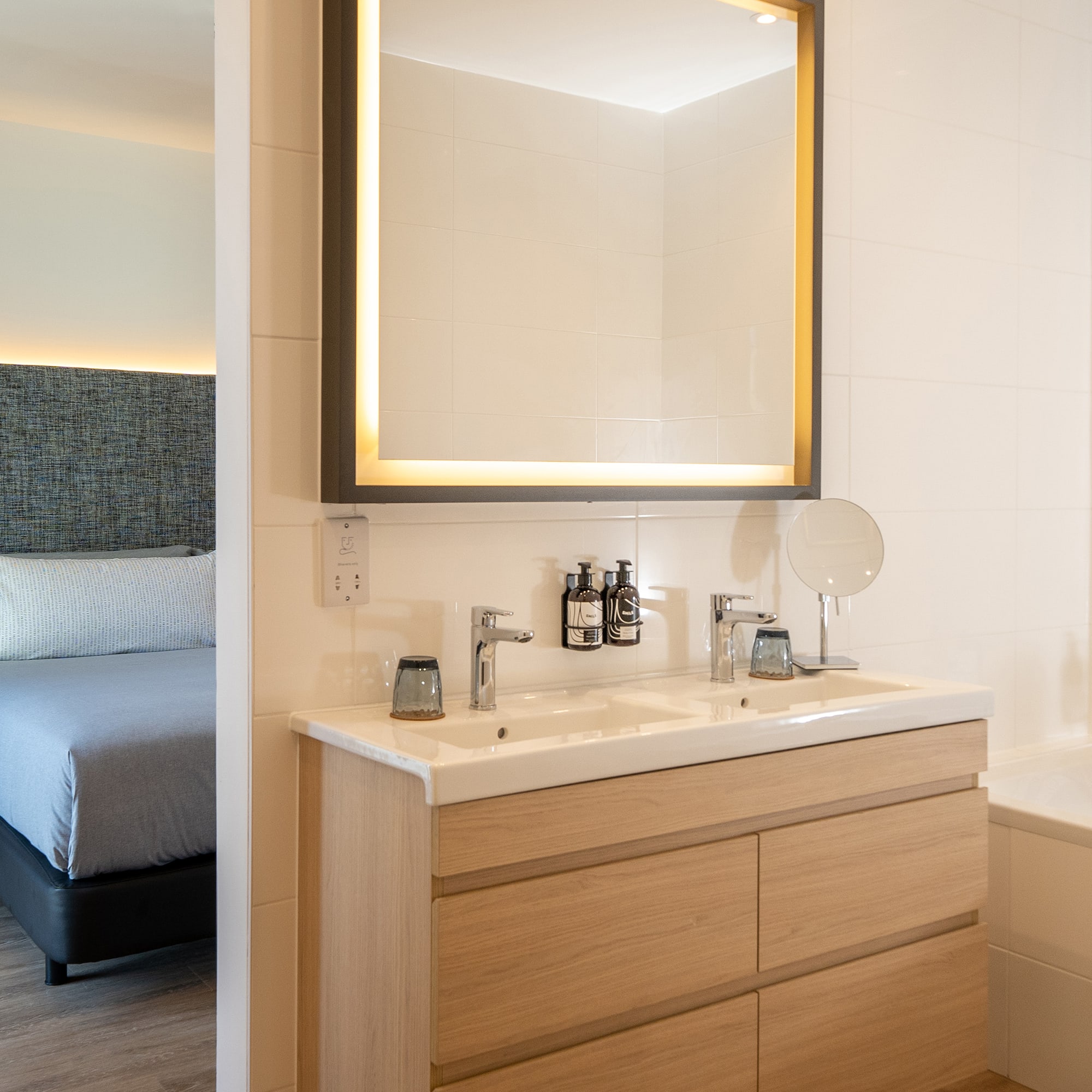 a bathroom with a mirror and a bathtub