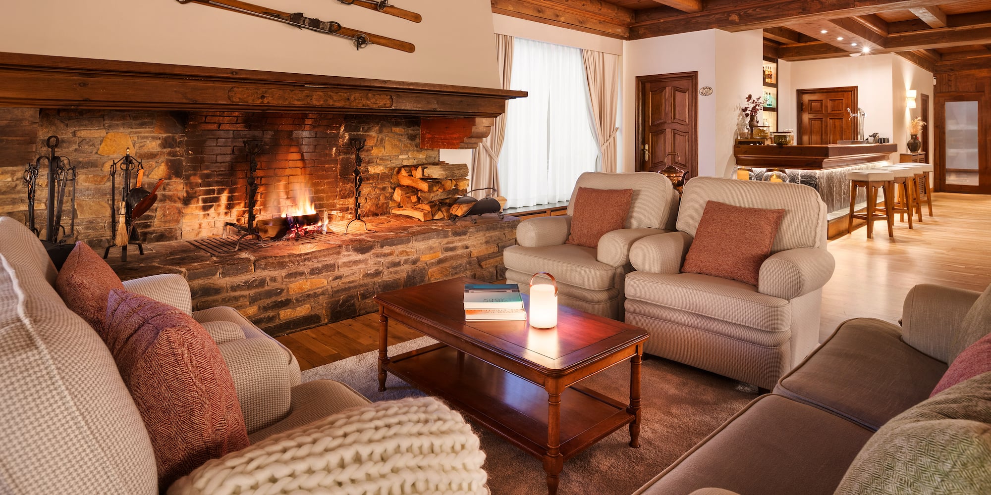 a living room with a fireplace and couches