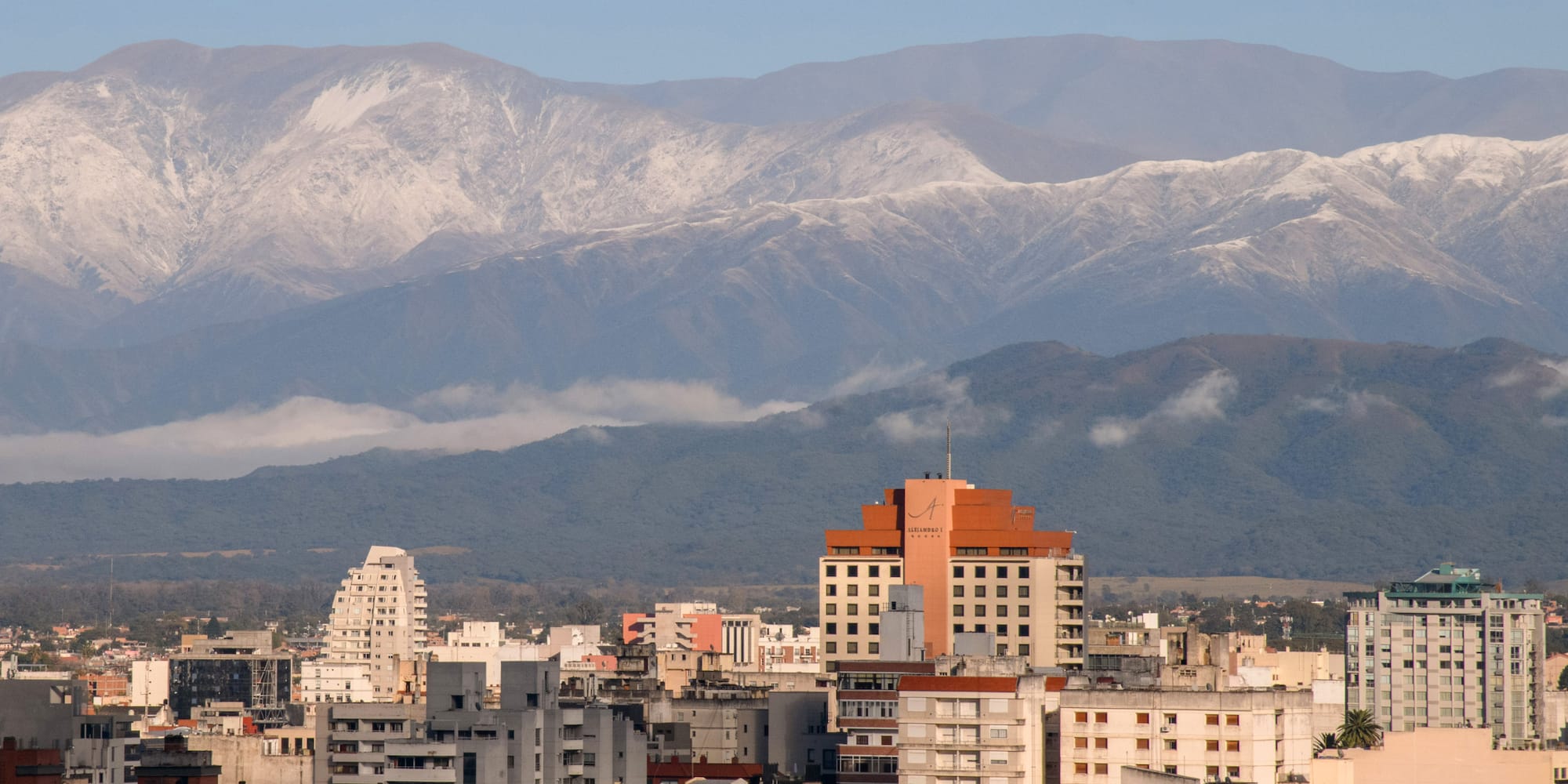 a city with mountains in the background