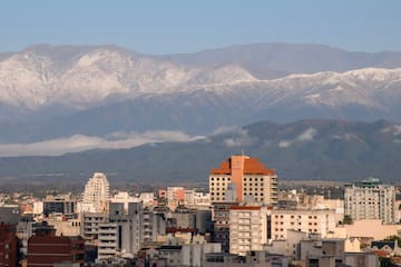 a city with mountains in the background