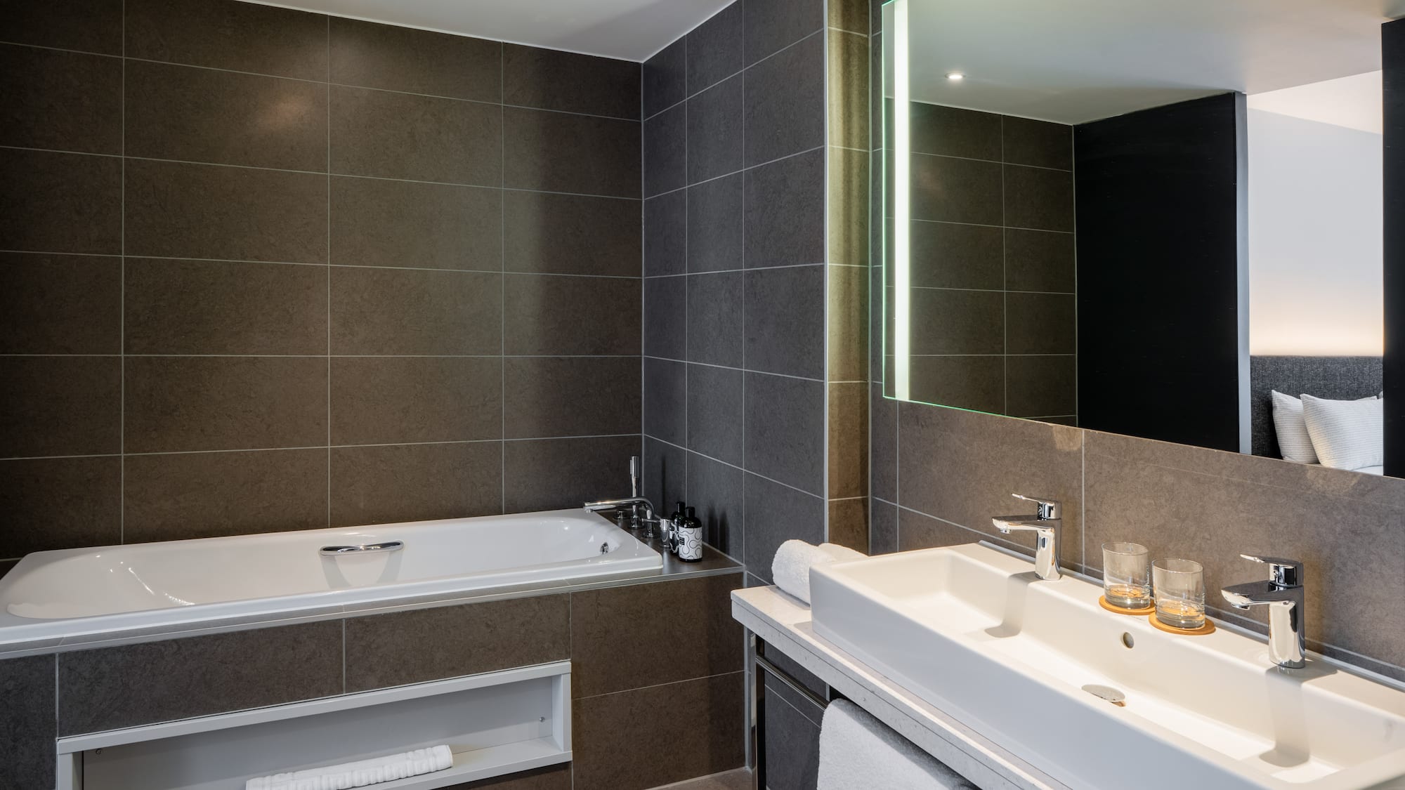 a bathroom with a bathtub and a mirror