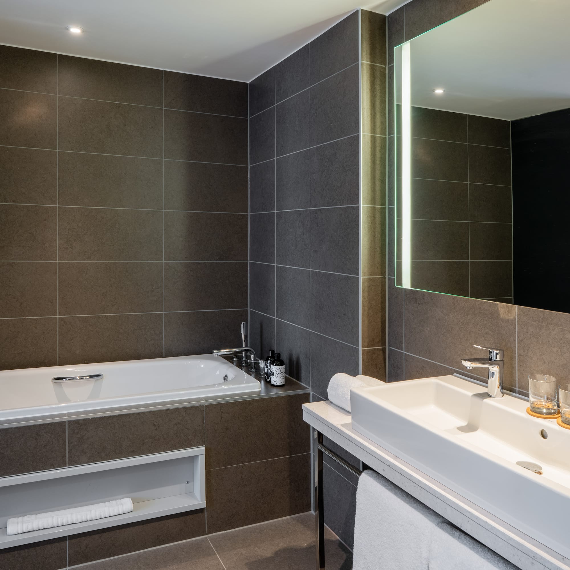 a bathroom with a bathtub and a mirror