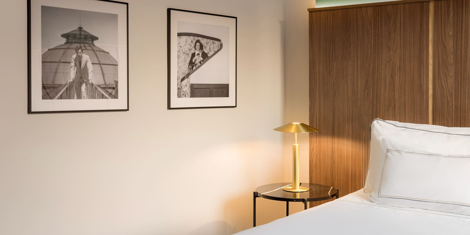 a bedroom with a bed and a lamp