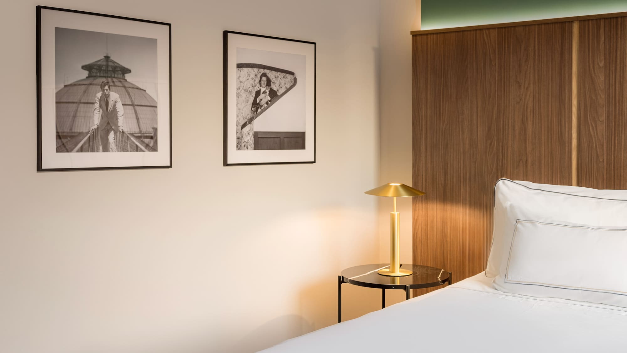 a bedroom with a bed and a lamp