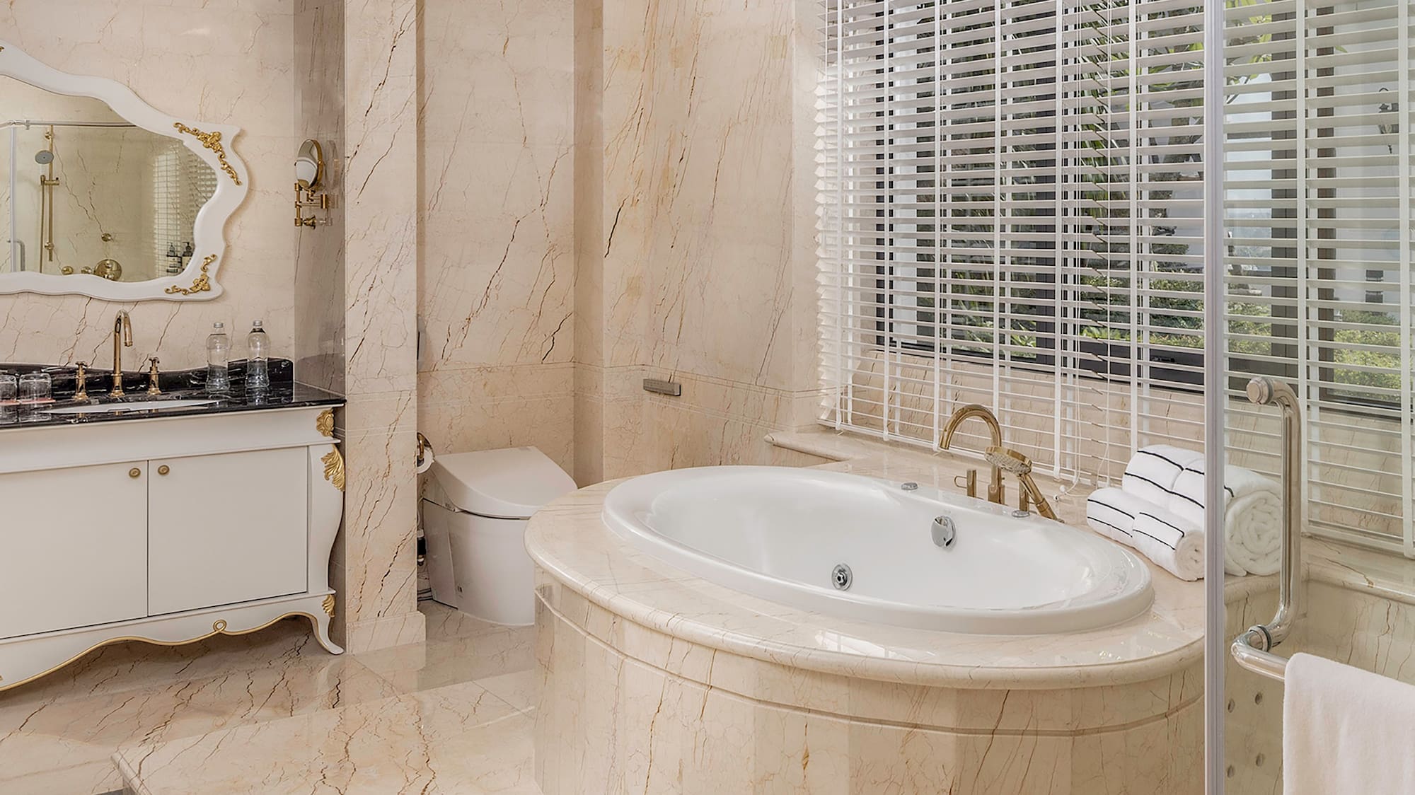 a bathroom with a tub and a shower