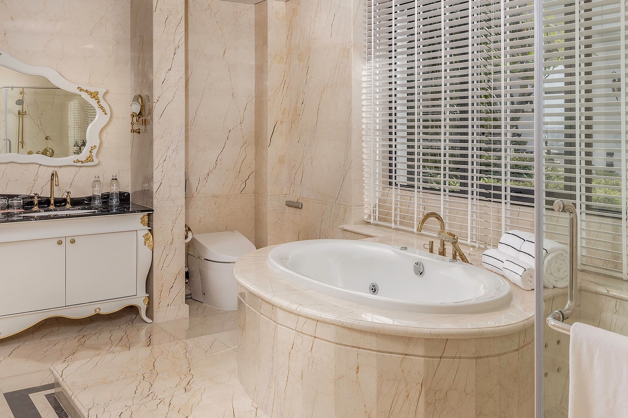 a bathroom with a tub and a shower