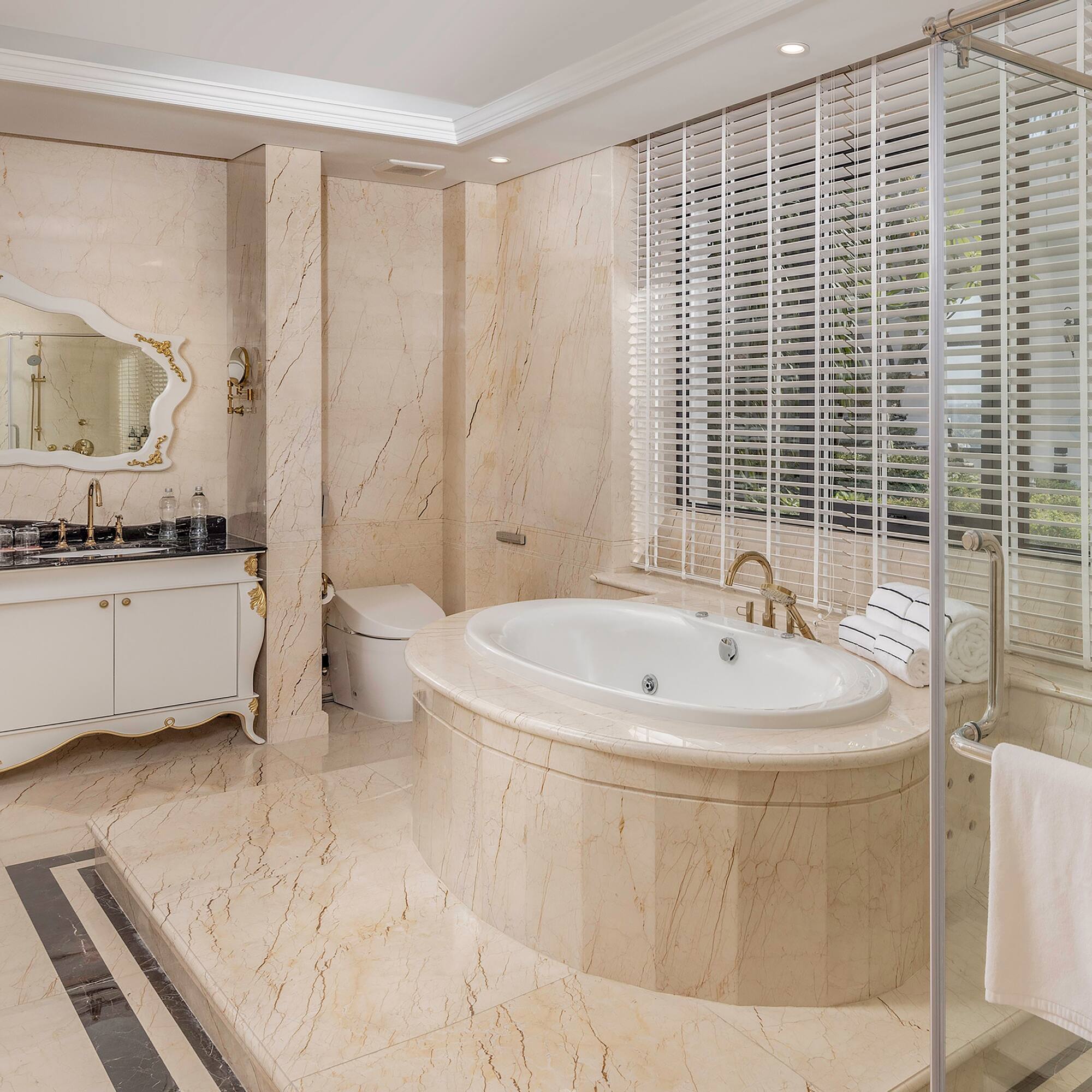 a bathroom with a tub and a shower