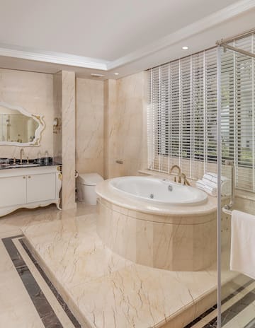 a bathroom with a tub and a shower