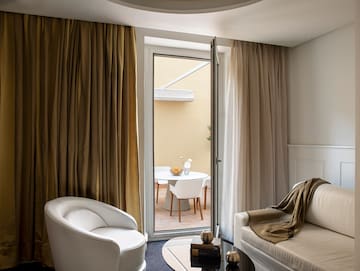 a room with a glass door and a couch