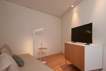 a tv on a cabinet in a room