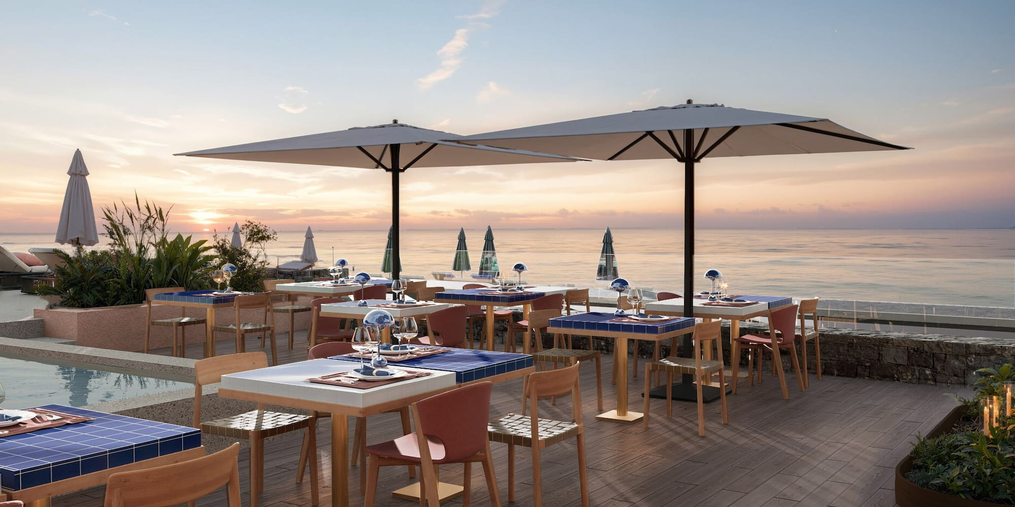 a restaurant with tables and umbrellas