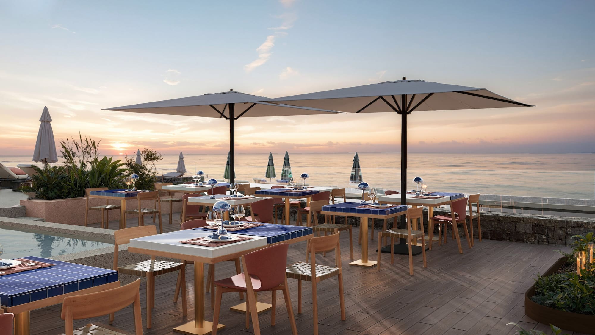 a restaurant with tables and umbrellas