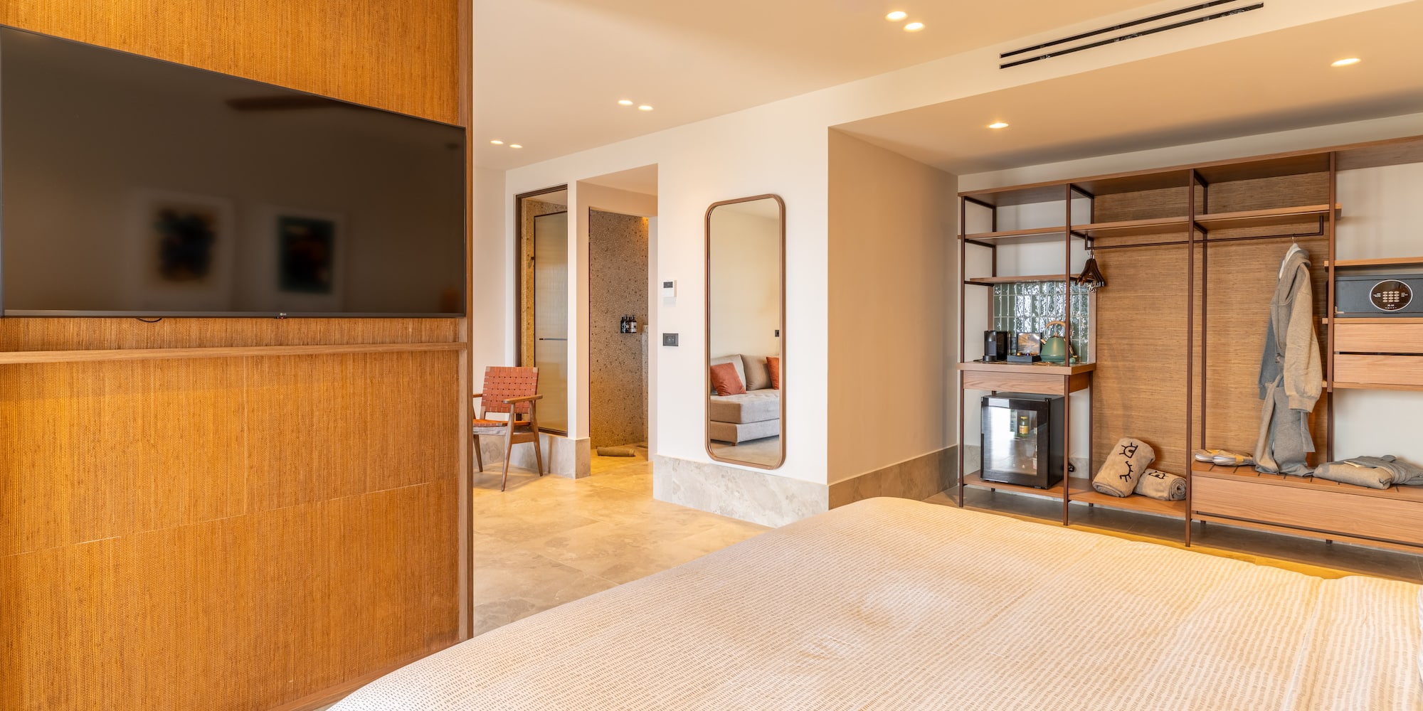 a room with a bed and a tv