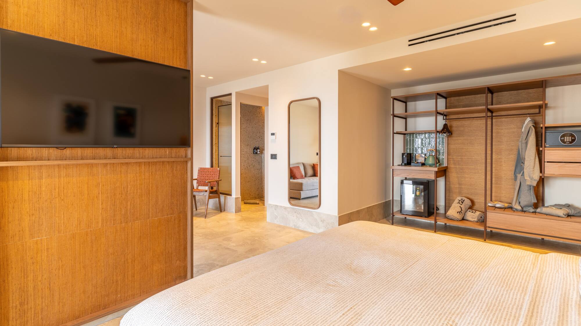 a room with a bed and a tv