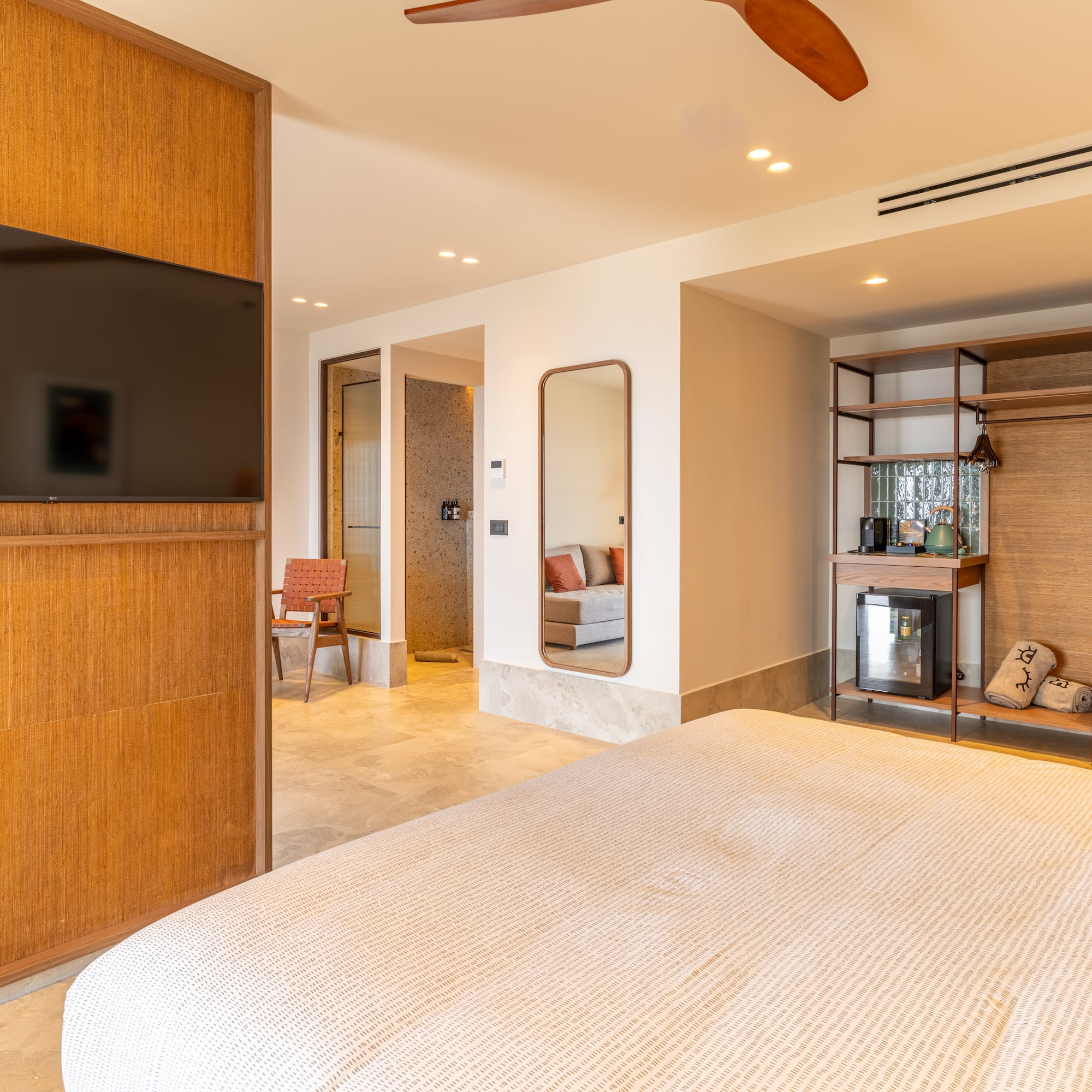 a room with a bed and a tv