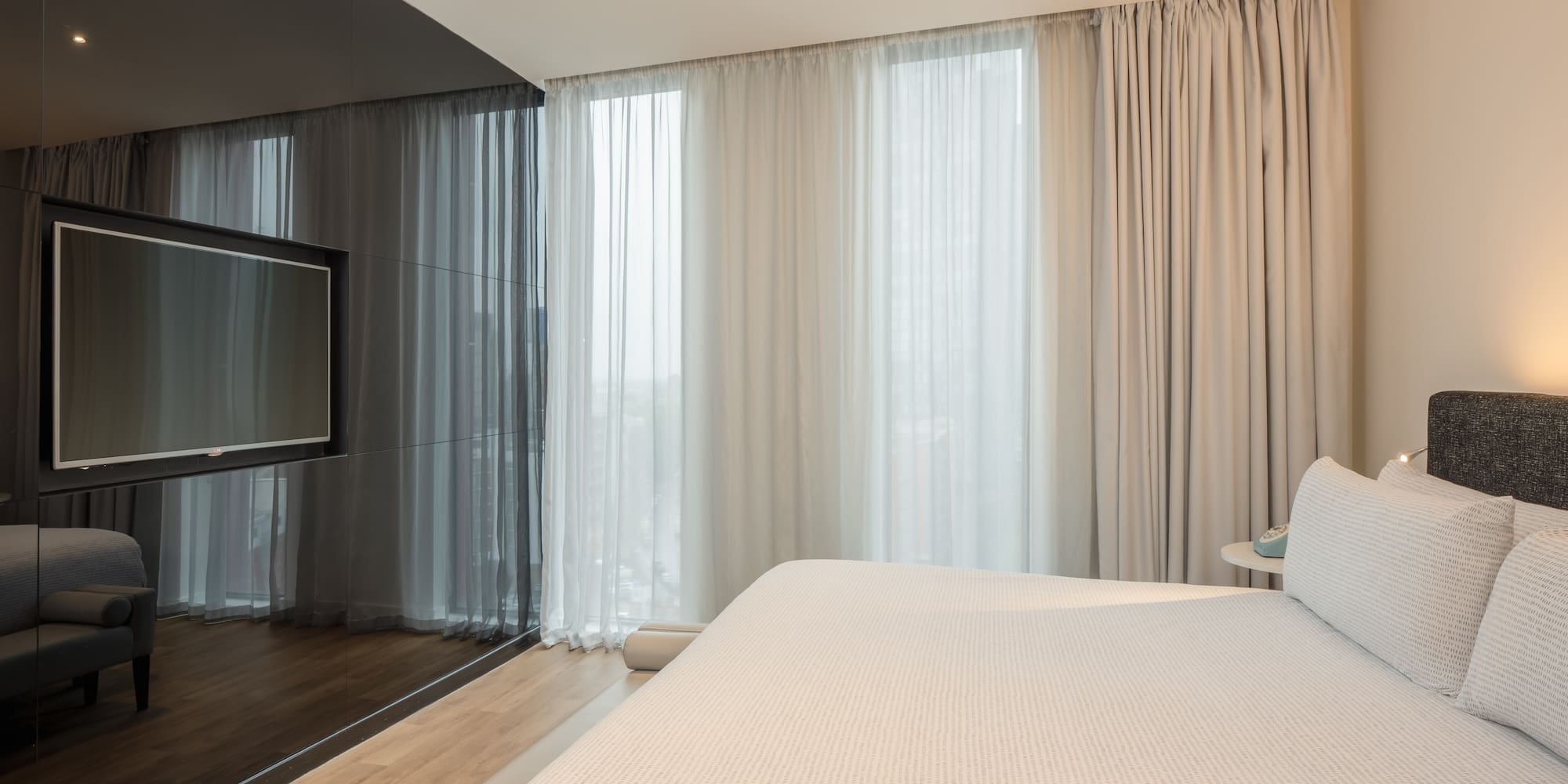 a bed in a room with a television