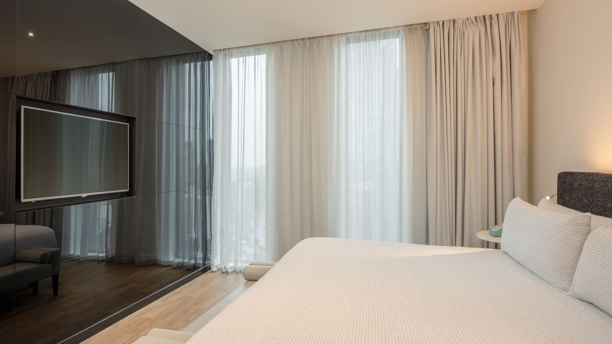 a bed in a room with a television