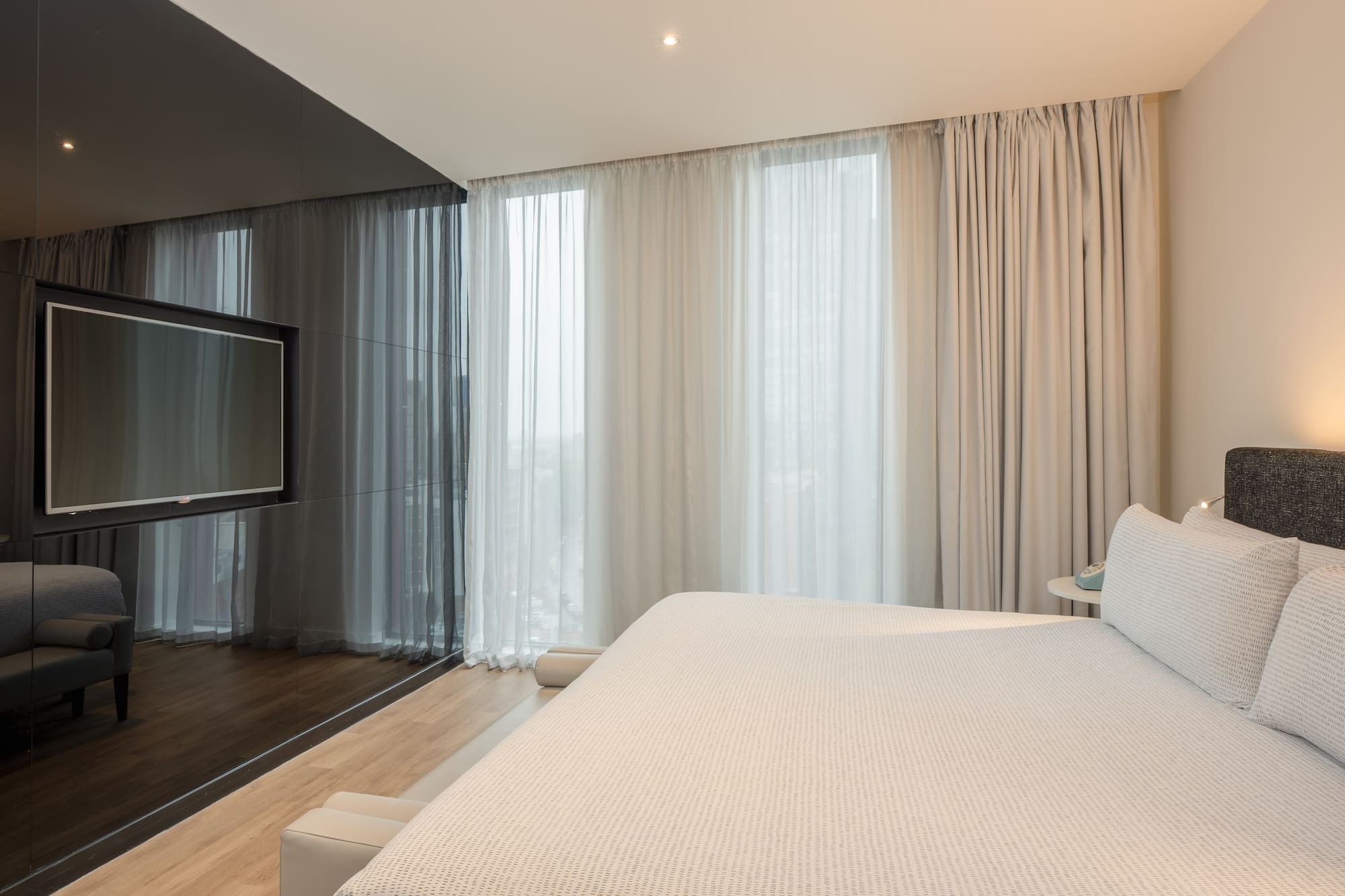 a bed in a room with a television