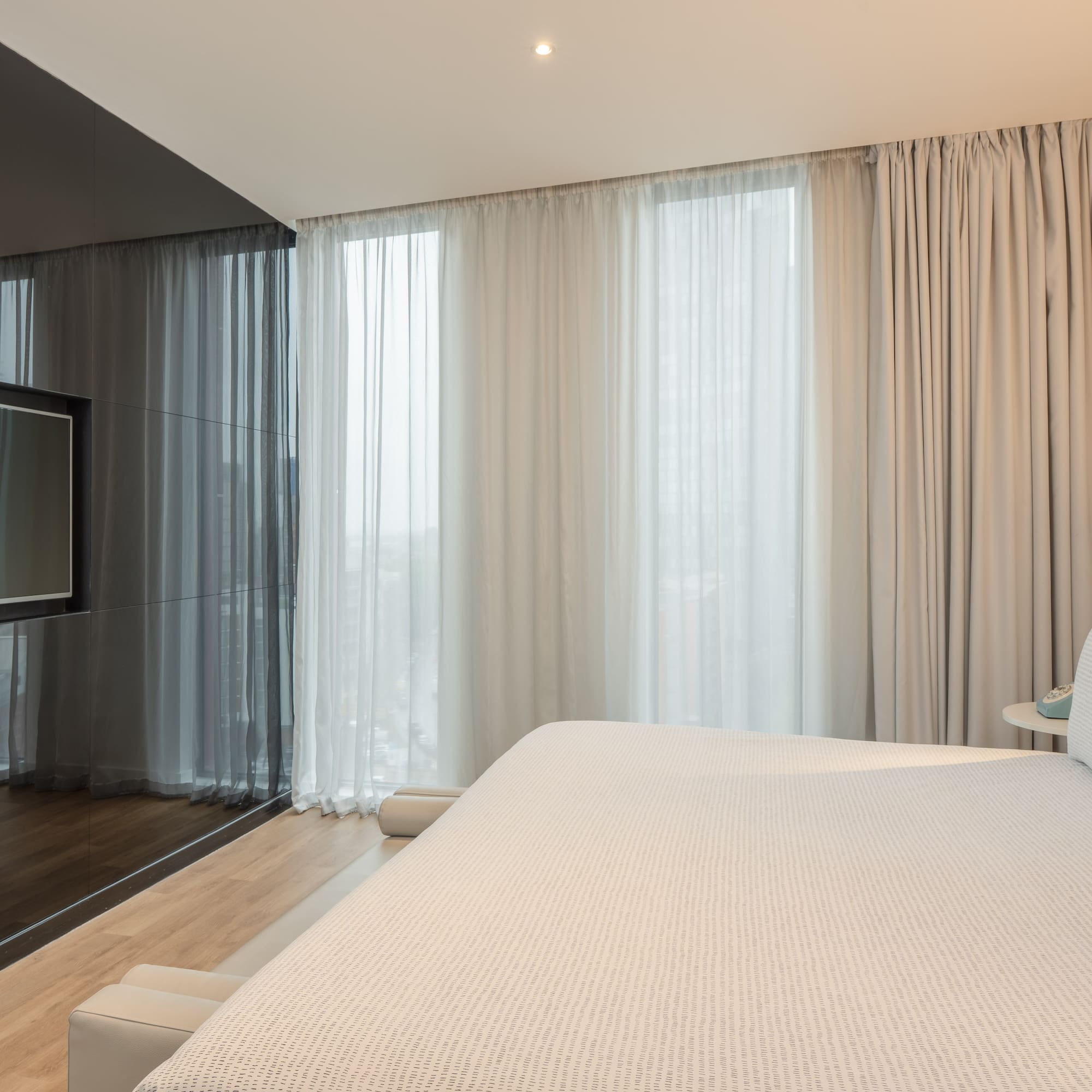 a bed in a room with a television