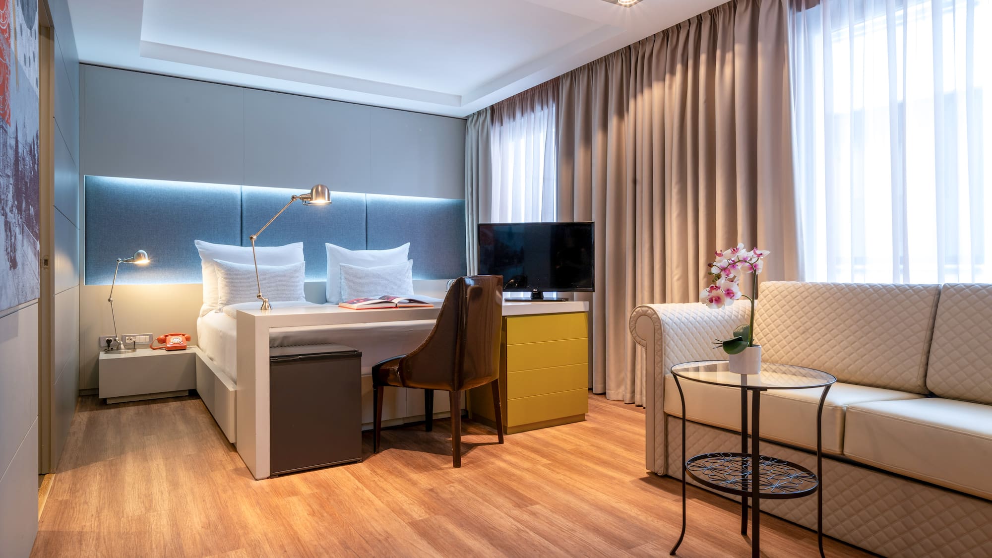 a room with a bed and a chair