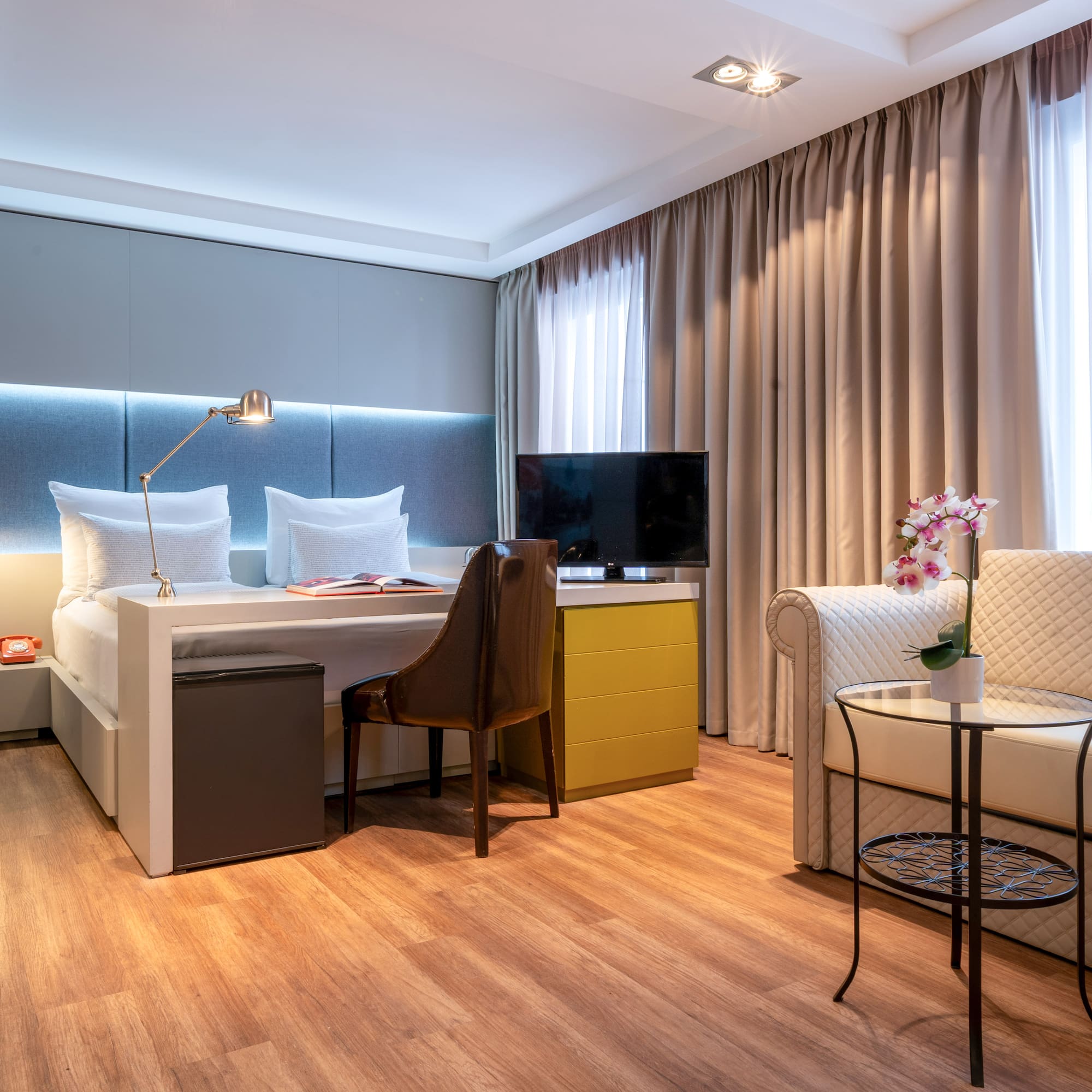 a room with a bed and a chair