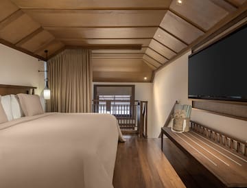 a room with a bed and a bench