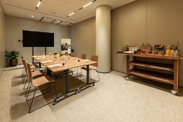 a room with a table and chairs