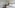 a bedroom with a bed and a desk