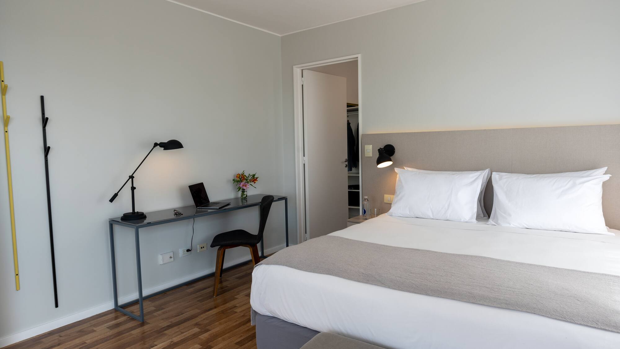 a bedroom with a bed and a desk
