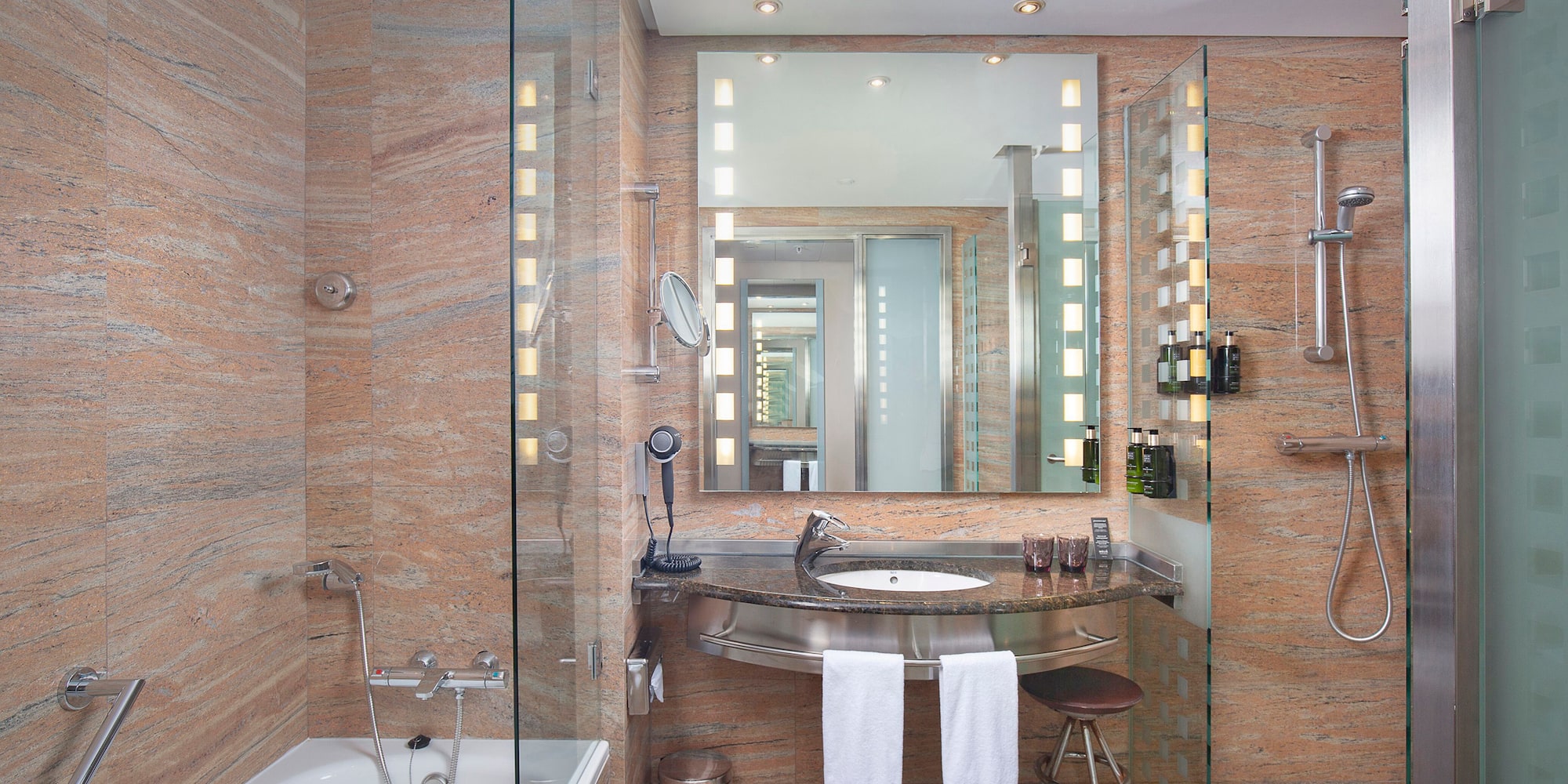a bathroom with a sink and a shower.