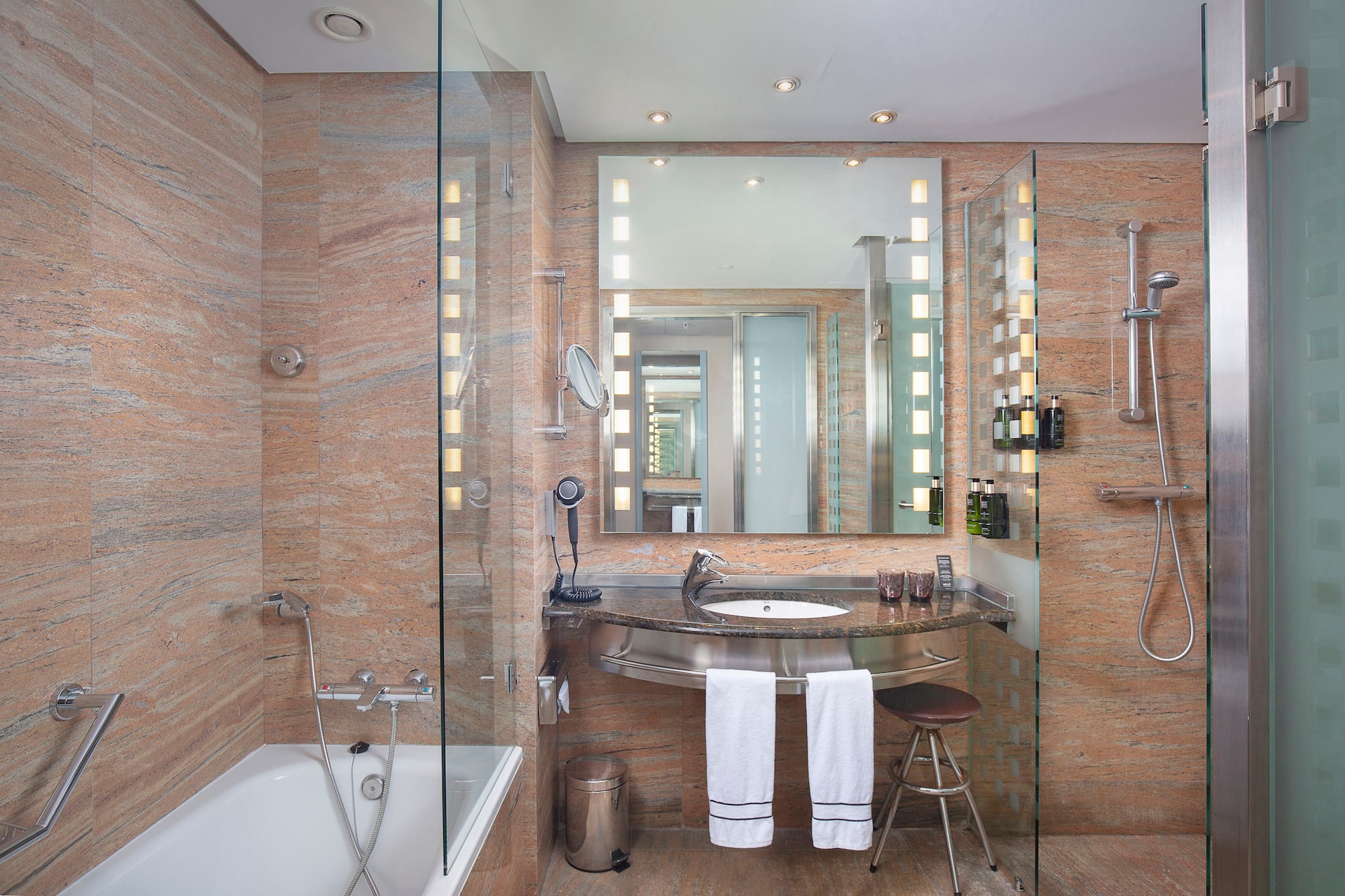 a bathroom with a sink and a shower.