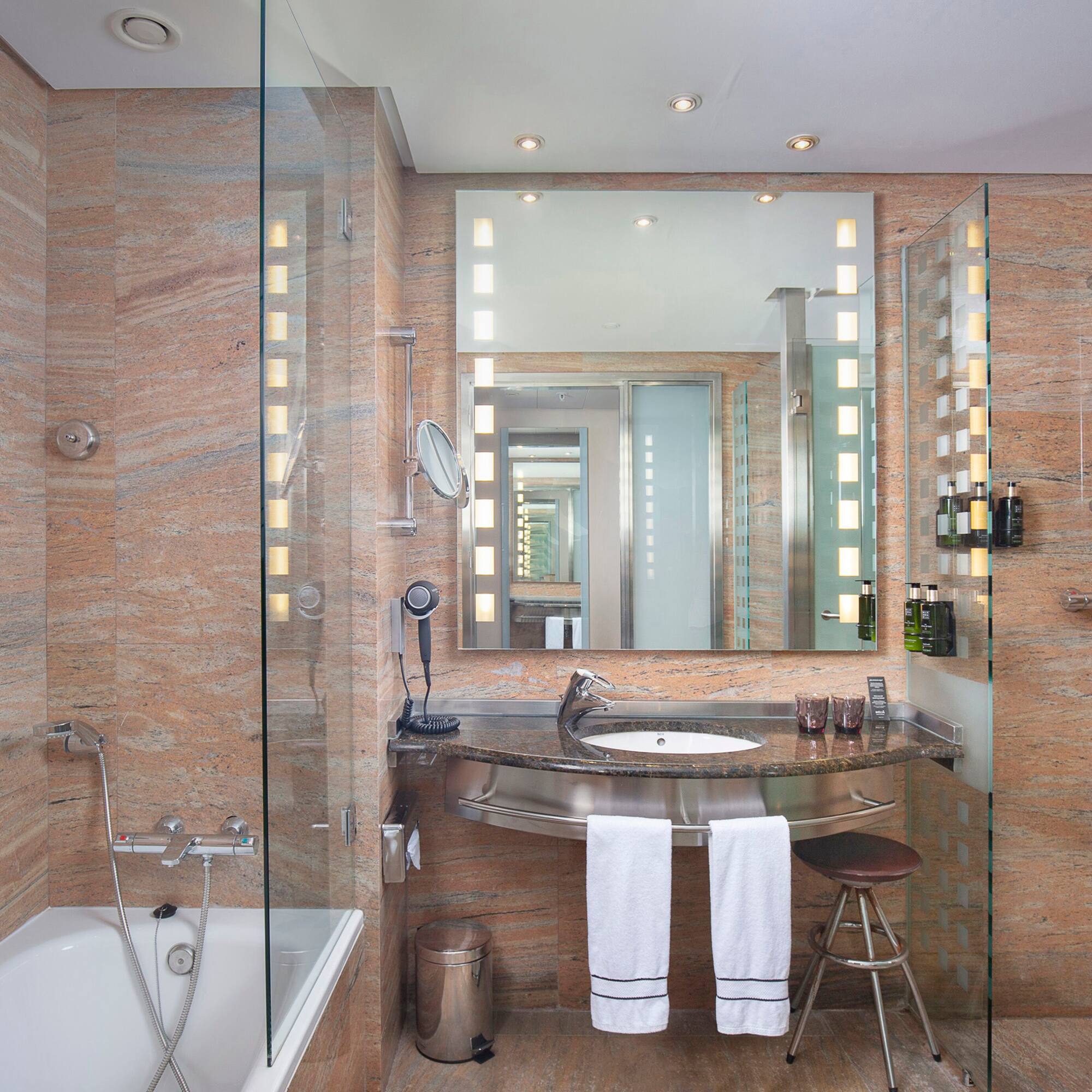 a bathroom with a sink and a shower.