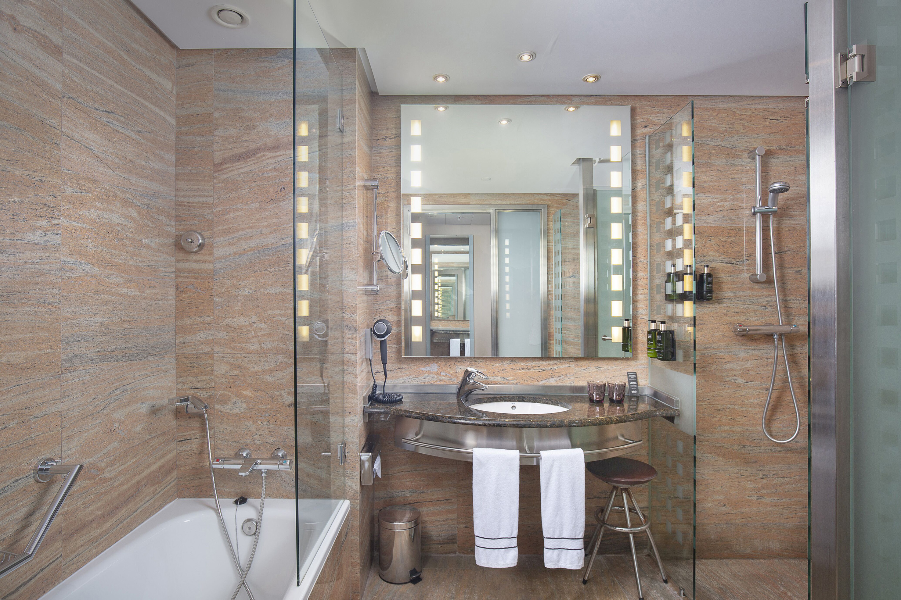 a bathroom with a sink and a shower.