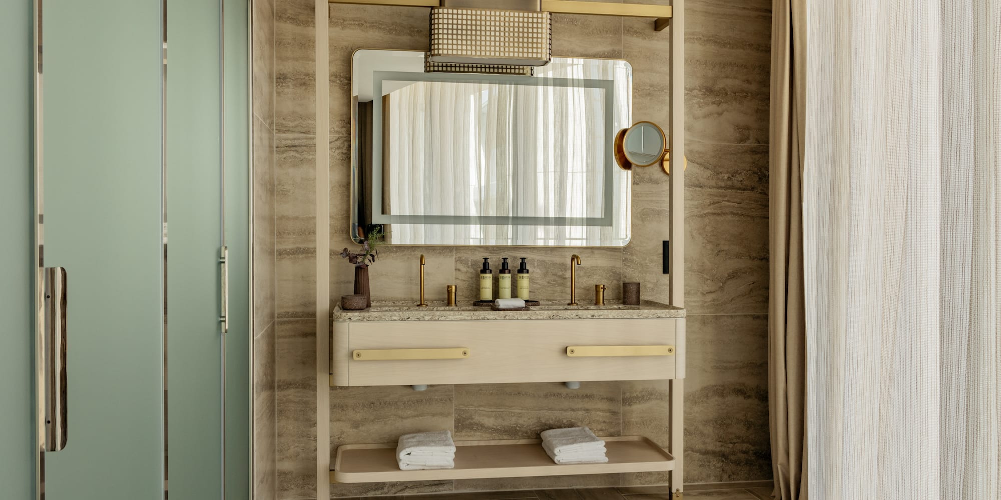 a bathroom with a mirror and sink