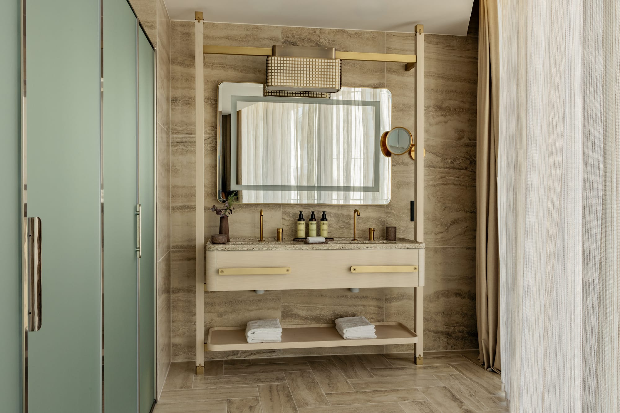 a bathroom with a mirror and sink