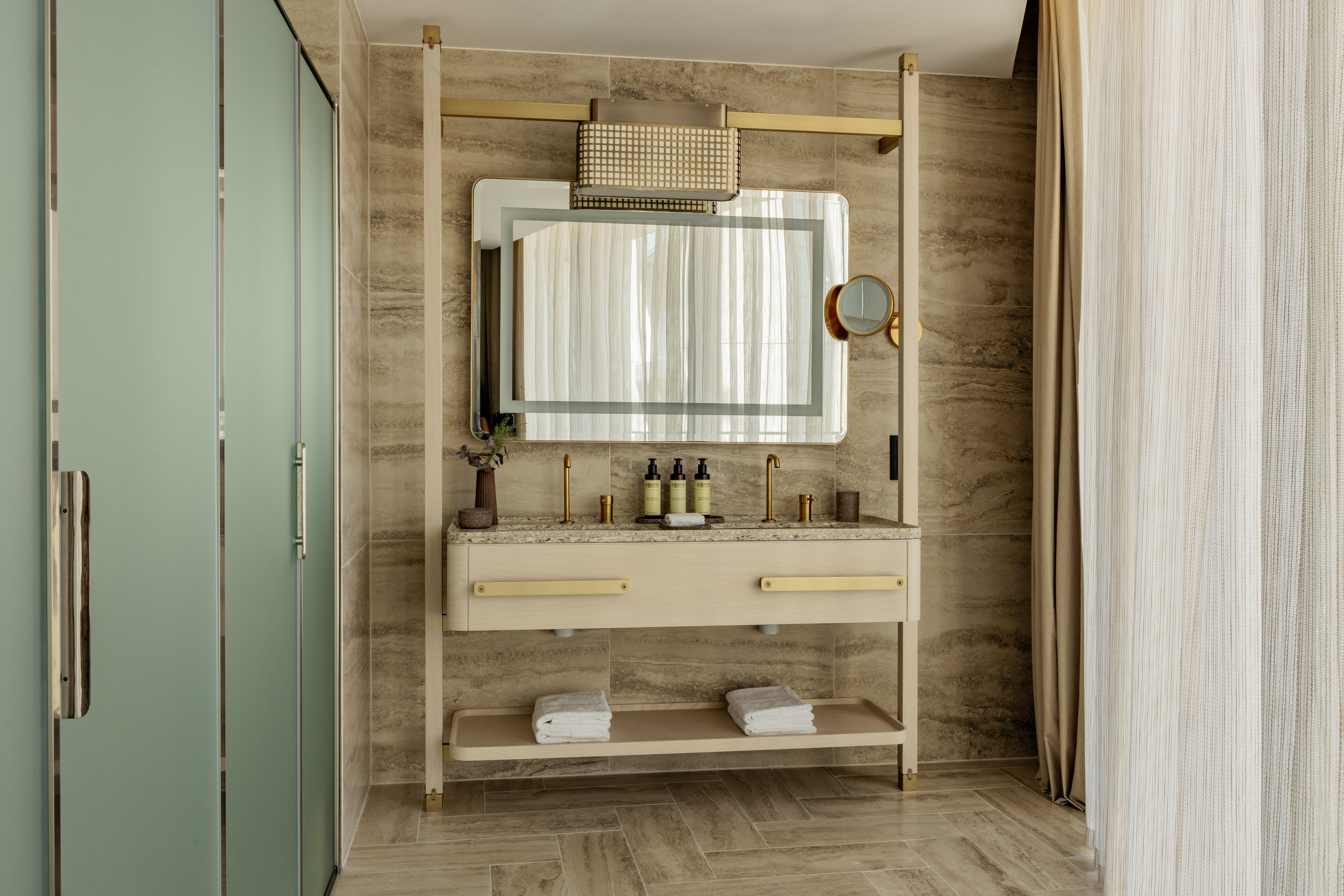 a bathroom with a mirror and sink