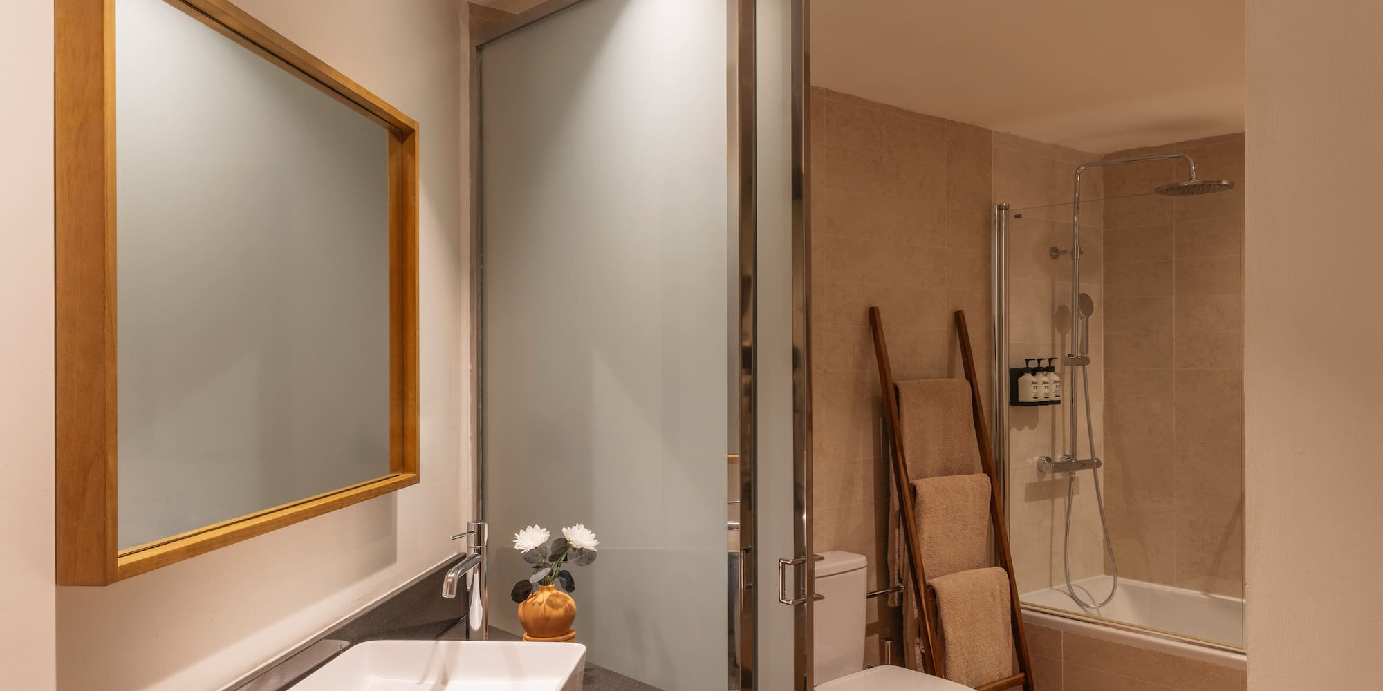 a bathroom with a sink toilet and shower