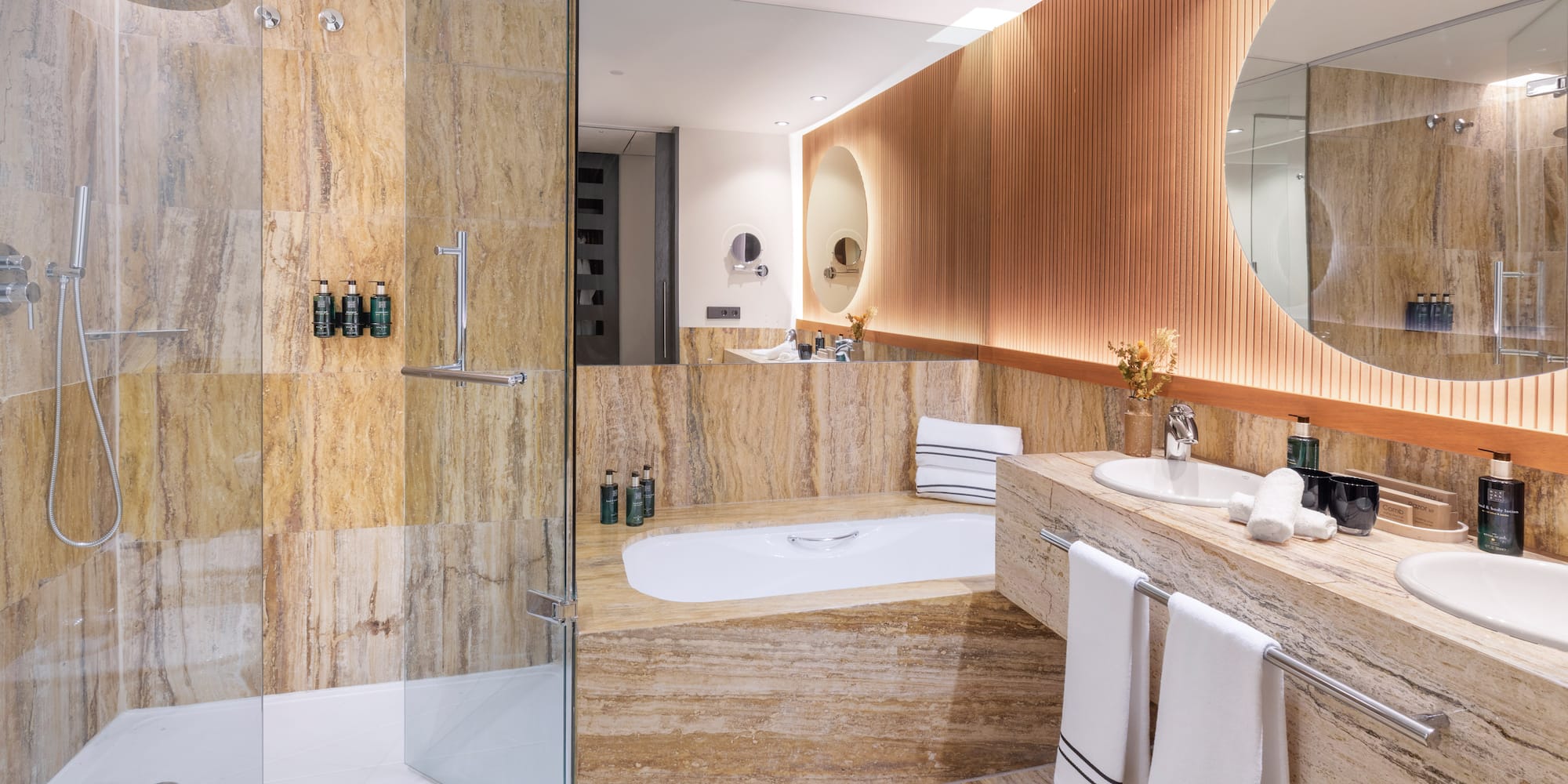 a bathroom with a tub and a shower