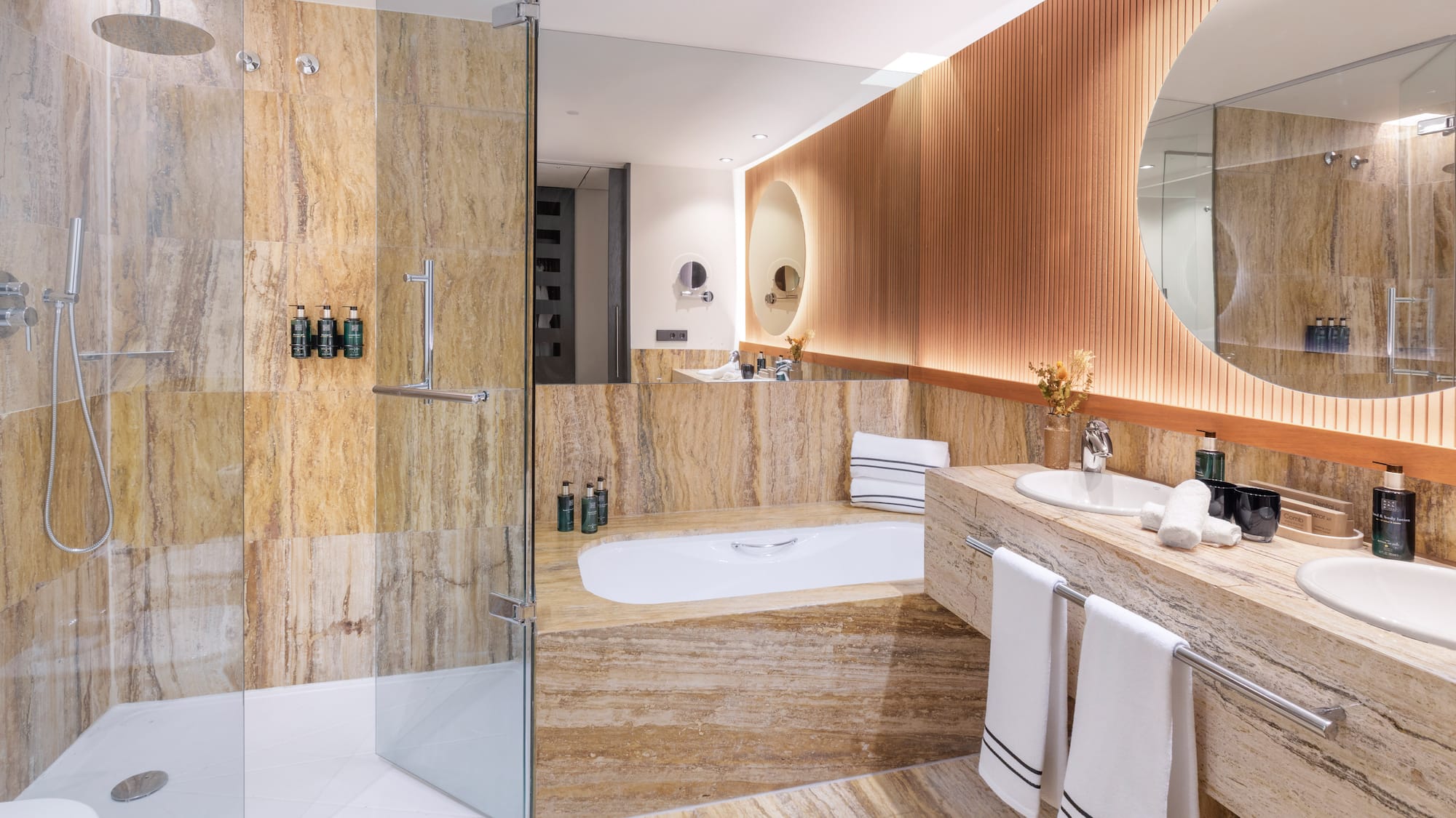 a bathroom with a tub and a shower